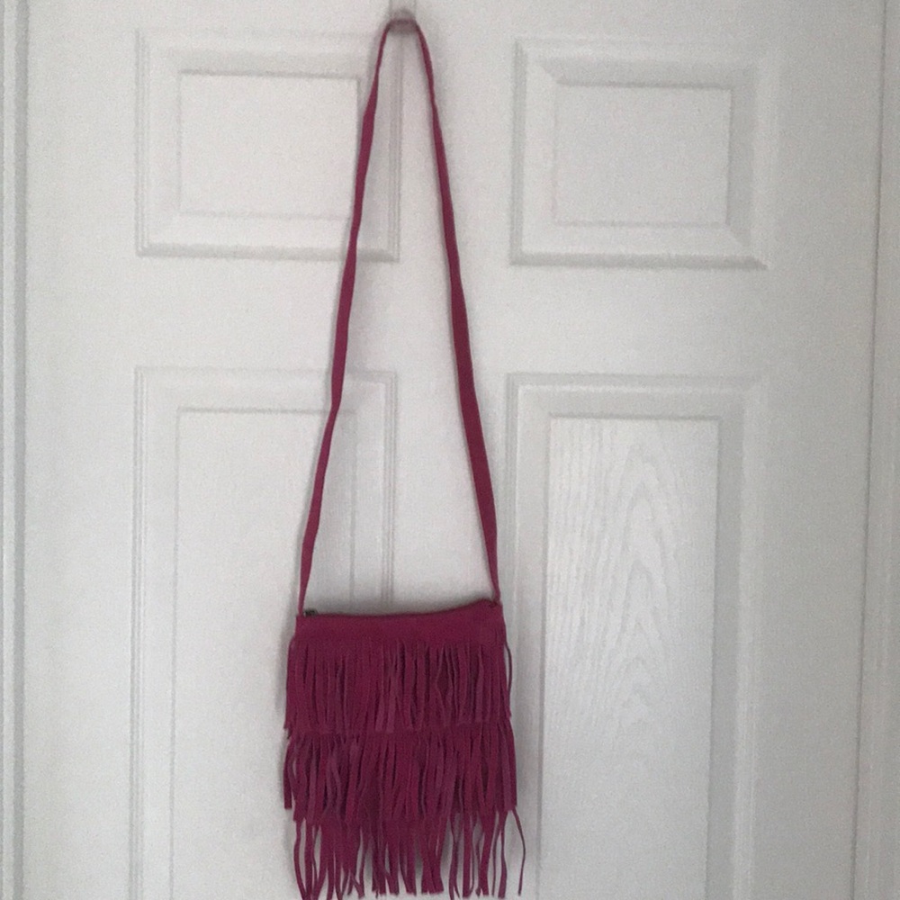 a frayed pink purse